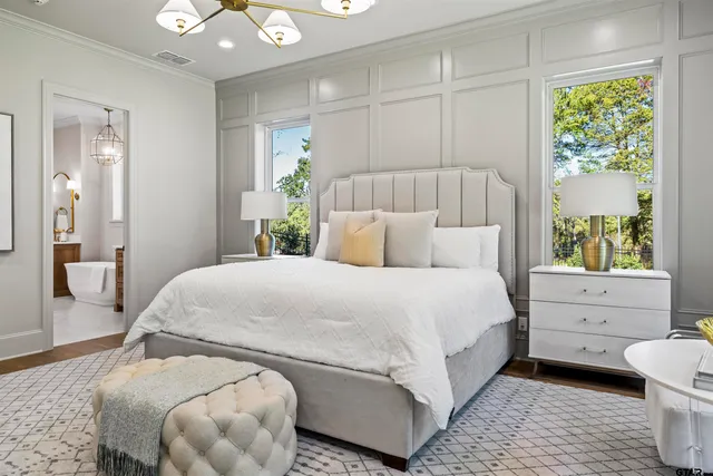 a bedroom with a bed and a dresser