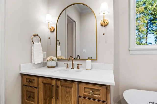 a bathroom with a sink and a mirror