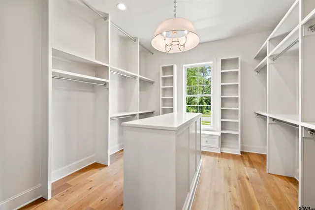 a view of cabinets and wooden floor
