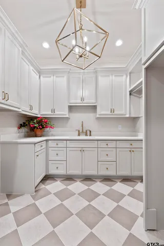 a kitchen with stainless steel appliances granite countertop cabinets a sink and a window