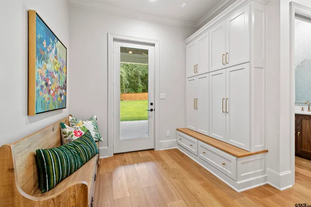 a living room with blue walls and a wooden floor