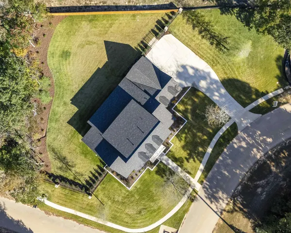 an aerial view of a house with swimming pool