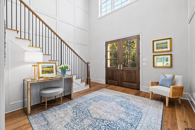 a living room with furniture and a rug