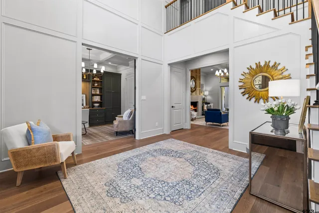 a living room with furniture and a rug