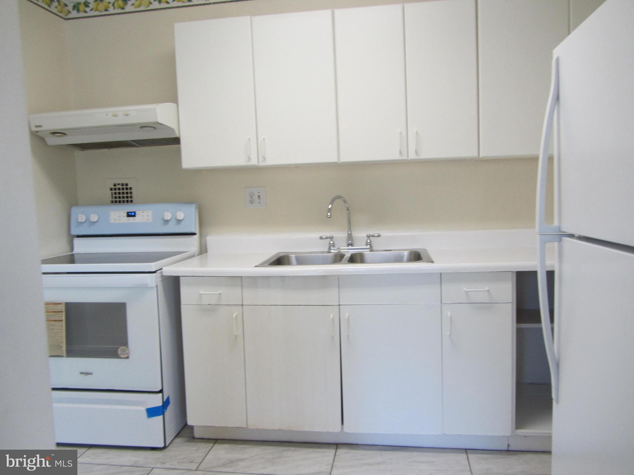 614 Sligo Avenue, Unit 303 Silver Spring, MD 20910 - Photo 12 of 31 a utility room with dryer and washer