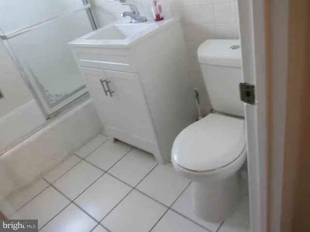 a bathroom with a sink a mirror and a shower