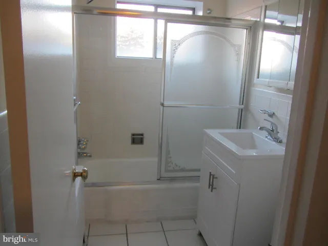 a bathroom with a sink and shower