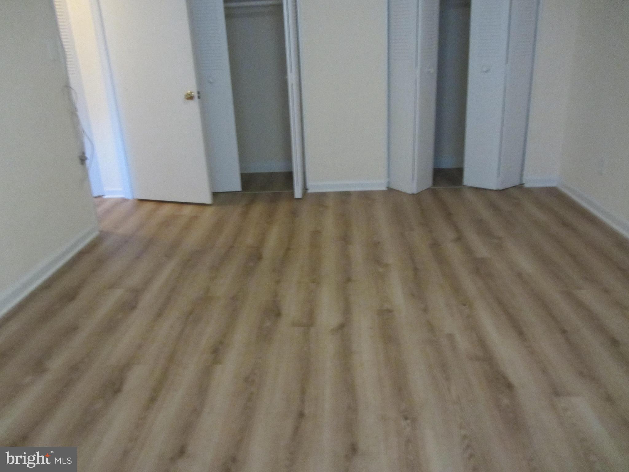 614 Sligo Avenue, Unit 303 Silver Spring, MD 20910 - Photo 23 of 31 a view of a room with wooden floor