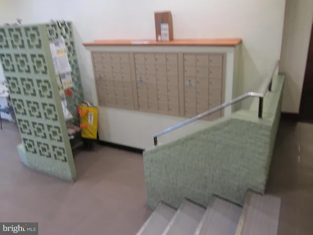 a lobby with furniture and potted plant