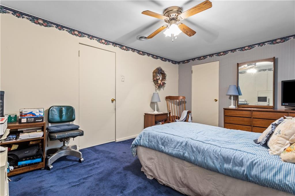 153 George Street Rochester, PA 15074 - Photo 12 of 25 a bedroom with a bed window and a chandelier