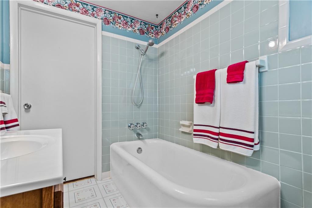 153 George Street Rochester, PA 15074 - Photo 15 of 25 a bathroom with a bathtub and a shower