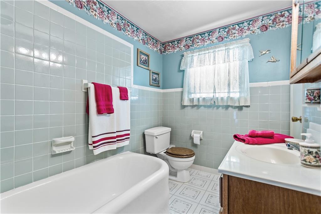 153 George Street Rochester, PA 15074 - Photo 16 of 25 a bathroom with a sink and a mirror