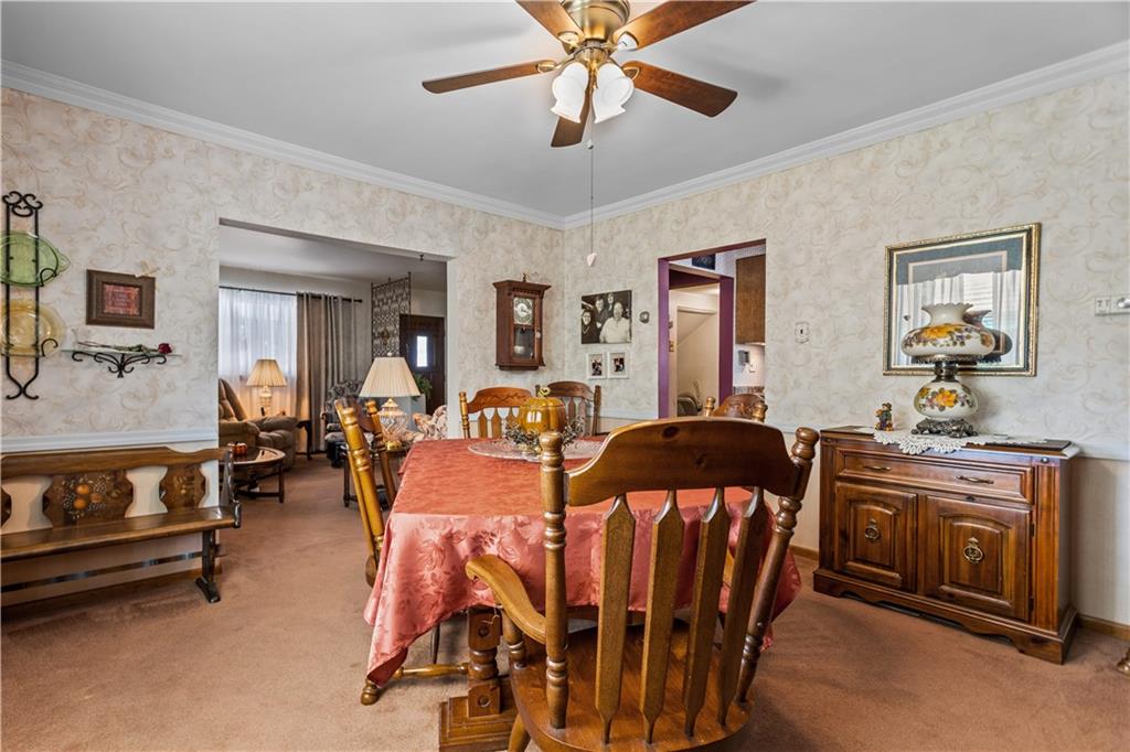 153 George Street Rochester, PA 15074 - Photo 4 of 25 a view of a dining room with furniture and chandelier