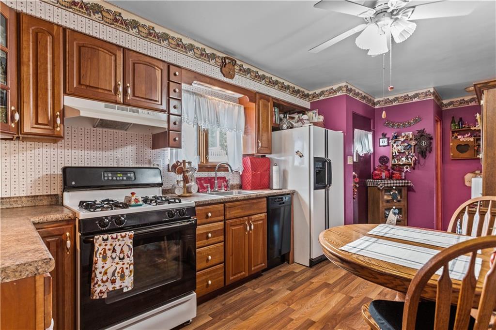 153 George Street Rochester, PA 15074 - Photo 7 of 25 a kitchen with stainless steel appliances granite countertop a stove a refrigerator and a stove
