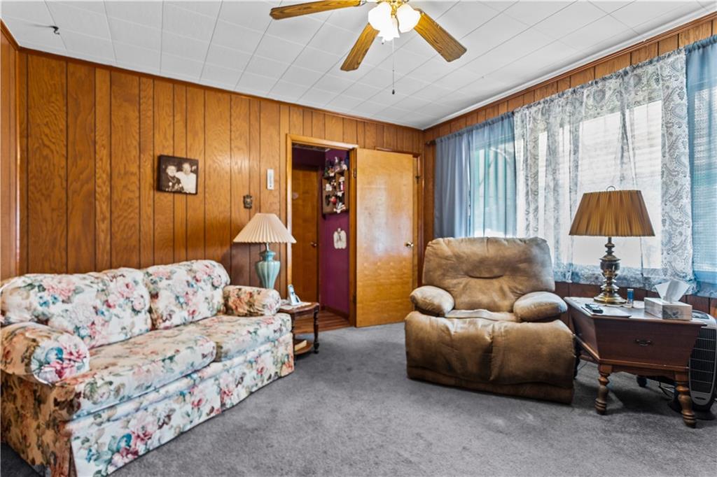 153 George Street Rochester, PA 15074 - Photo 8 of 25 a living room with furniture and a large window