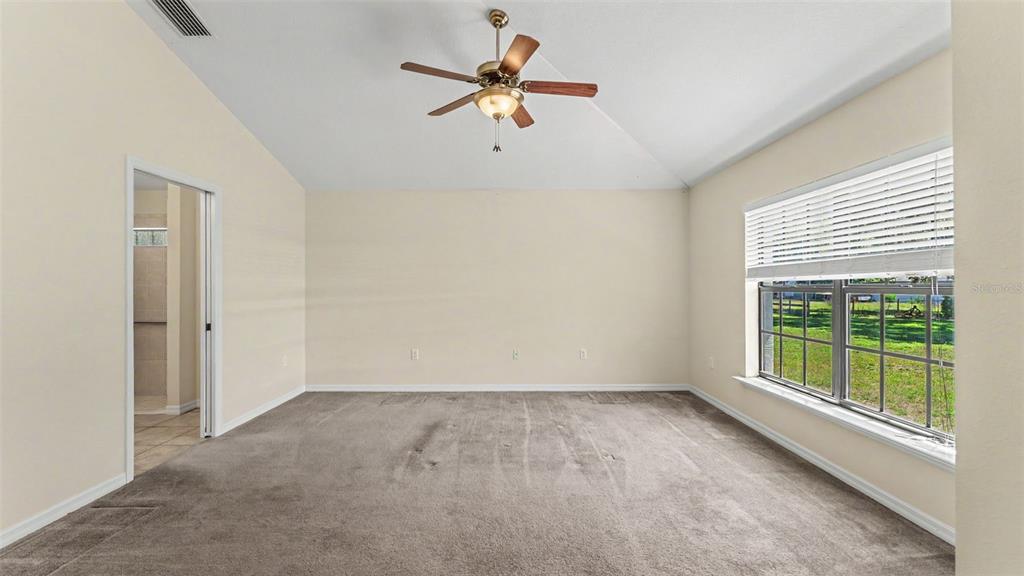 8525 North Campbell Road Lakeland, FL 33810 - Photo 23 of 45 wooden floor in an empty room with a window