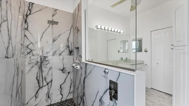 a bathroom with a shower and a sink