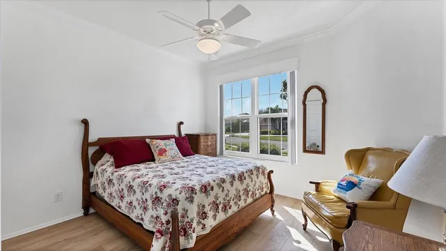 a bedroom with a bed and chair