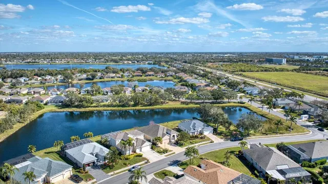 an aerial view of a city with lake view