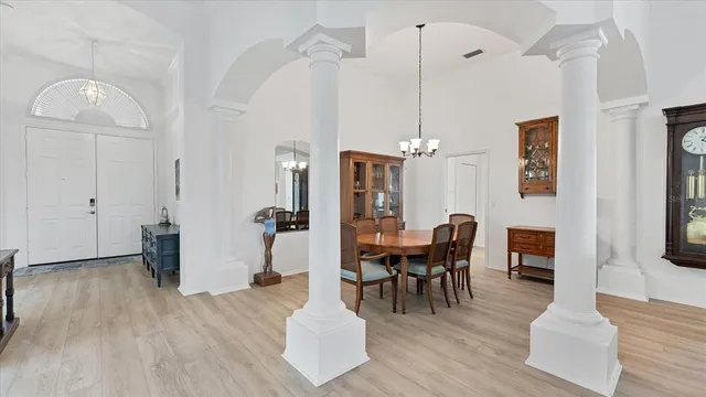 a view of a dining room with furniture and wooden floor