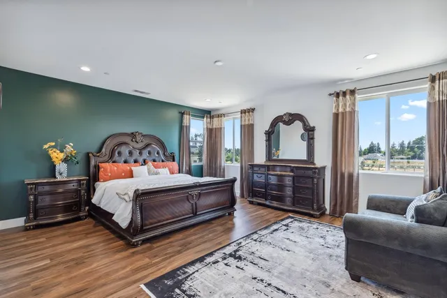 a bedroom with a bed and a dresser