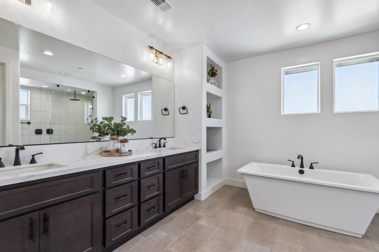 1765 North Renn Avenue Clovis, CA 93619 - Photo 35 of 50 a bathroom with a tub double sink and mirror