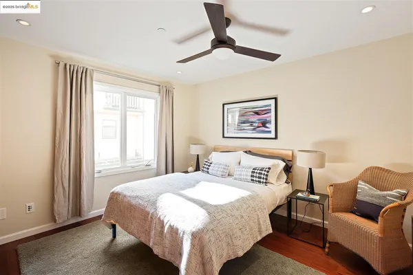 a bedroom with a bed and a couch