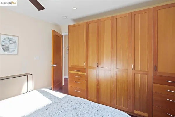 a bedroom with a bed and curtain