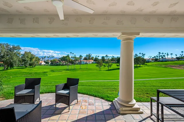 a view of a garden with chairs