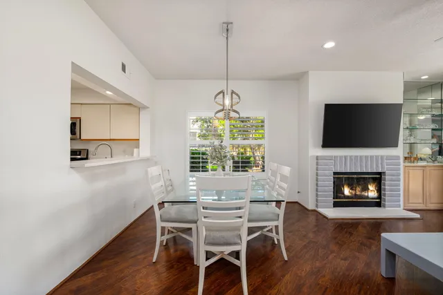 a kitchen with stainless steel appliances a sink and a refrigerator