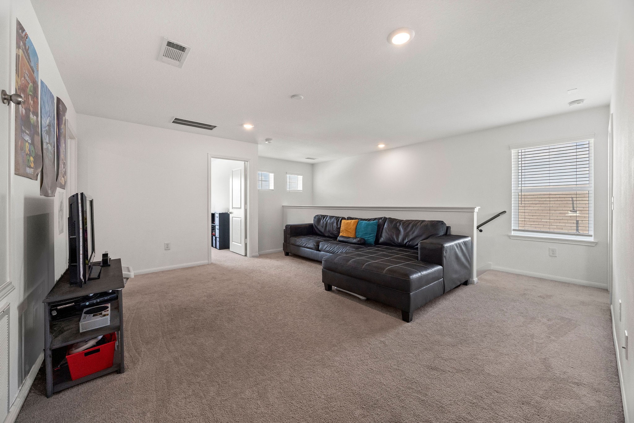 23334 Simmental Road Hockley, TX 77447 - Photo 24 of 38 The upstairs game room area is currently serving as a second living space perfect for the kids.