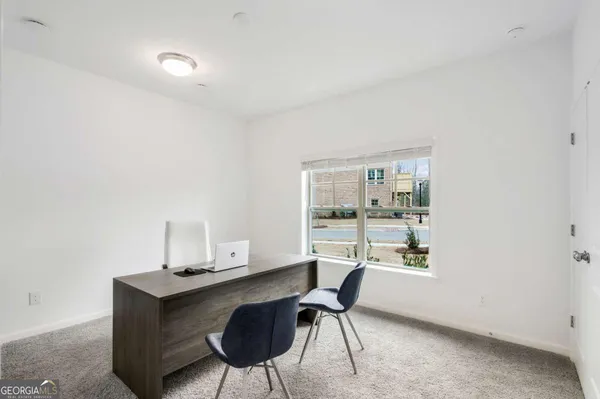 a workspace with furniture and a window