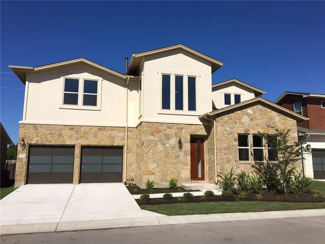 a front view of a house with yard