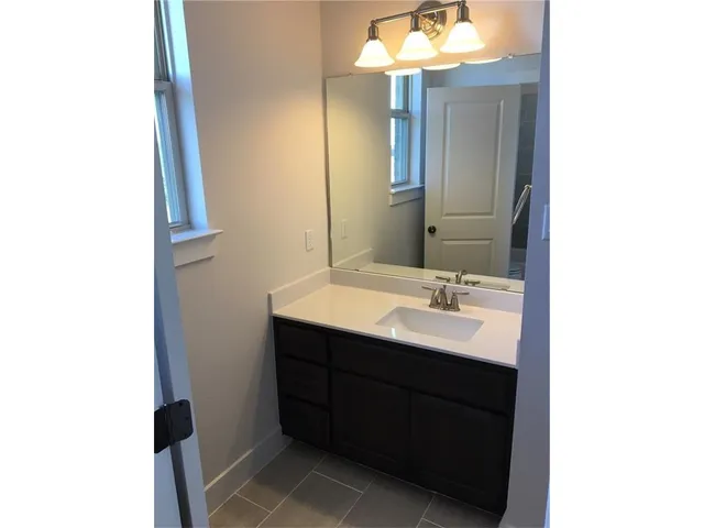 a white bath tub sitting next to a white toilet