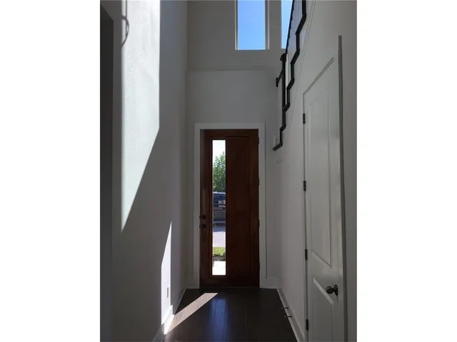 a view of an entryway with a hallway