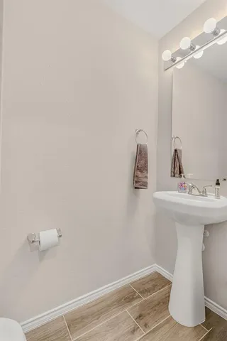 a bathroom with a sink and mirror