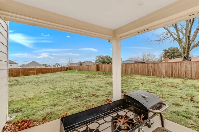 a view of a yard with an outdoor space