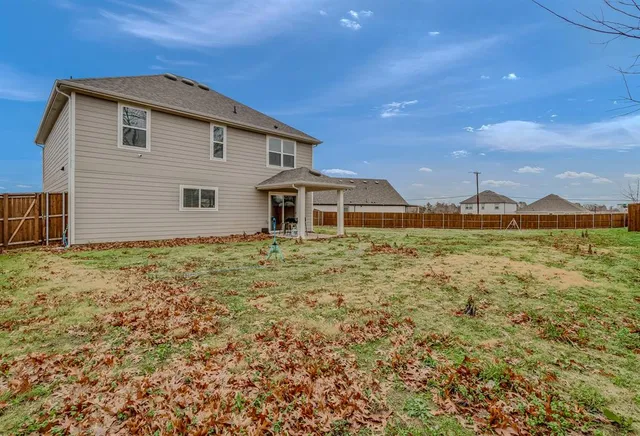 a house view with a garden space