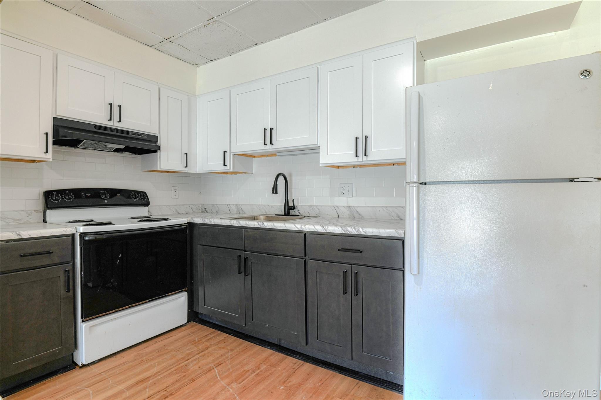 1614 Rte 9W, Unit 3 Milton, NY 12547 - Photo 4 of 13 a kitchen with stainless steel appliances granite countertop a refrigerator and a stove top oven