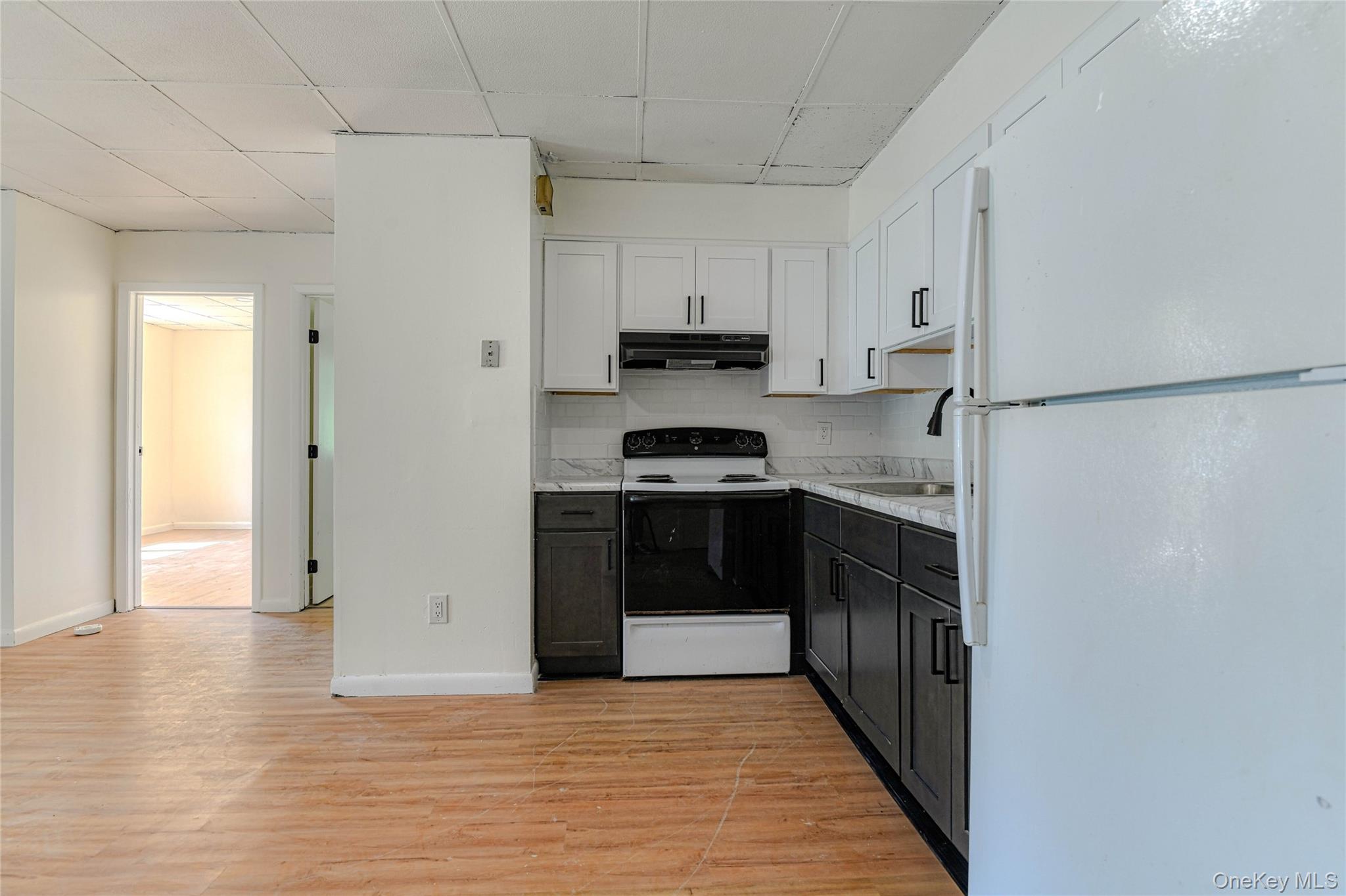 1614 Rte 9W, Unit 3 Milton, NY 12547 - Photo 6 of 13 a kitchen with stainless steel appliances granite countertop a refrigerator and a stove