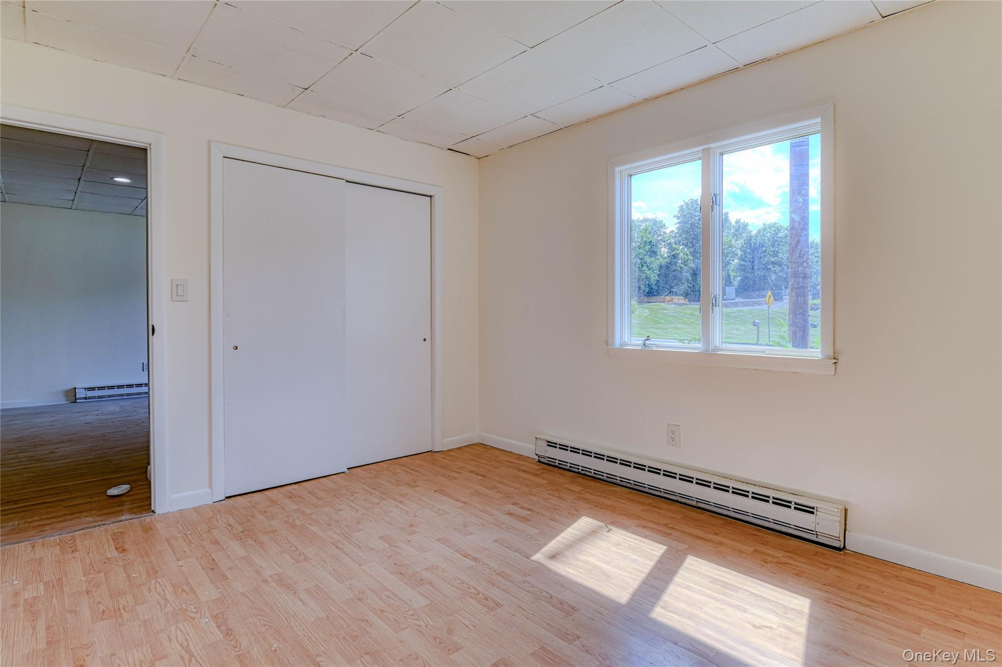 1614 Rte 9W, Unit 3 Milton, NY 12547 - Photo 9 of 13 an empty room with wooden floor and windows
