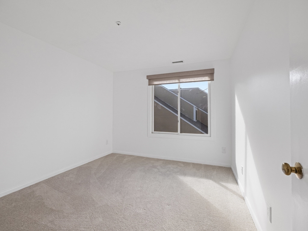 18 Concord Greene, Unit 6 Concord, MA 01742 - Photo 18 of 31 a view of an empty room with a window