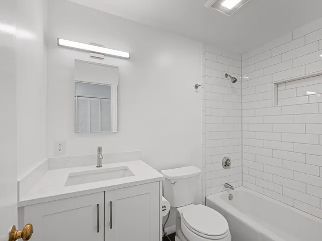 a view of hallway with wooden floor
