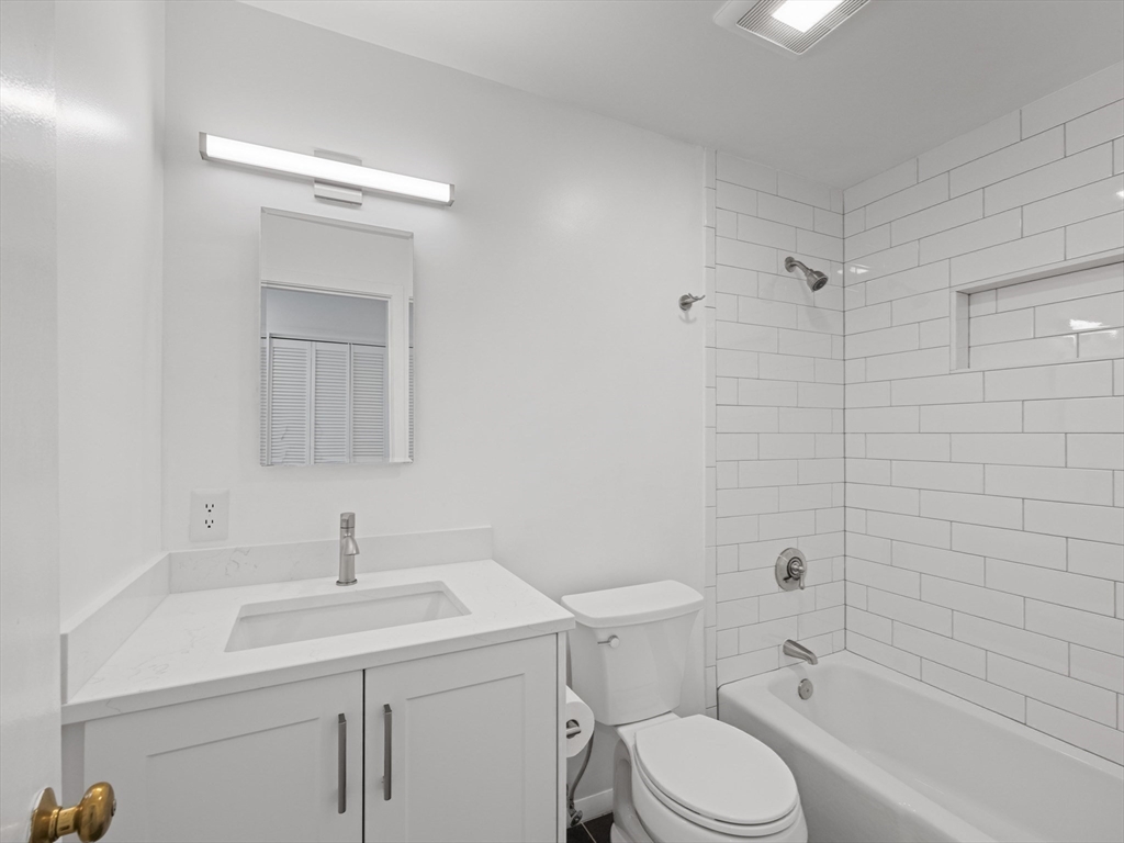 18 Concord Greene, Unit 6 Concord, MA 01742 - Photo 20 of 31 a bathroom with a sink toilet and shower