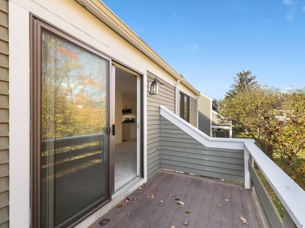 18 Concord Greene, Unit 6 Concord, MA 01742 - Photo 24 of 31 a view of a glass door with a large window