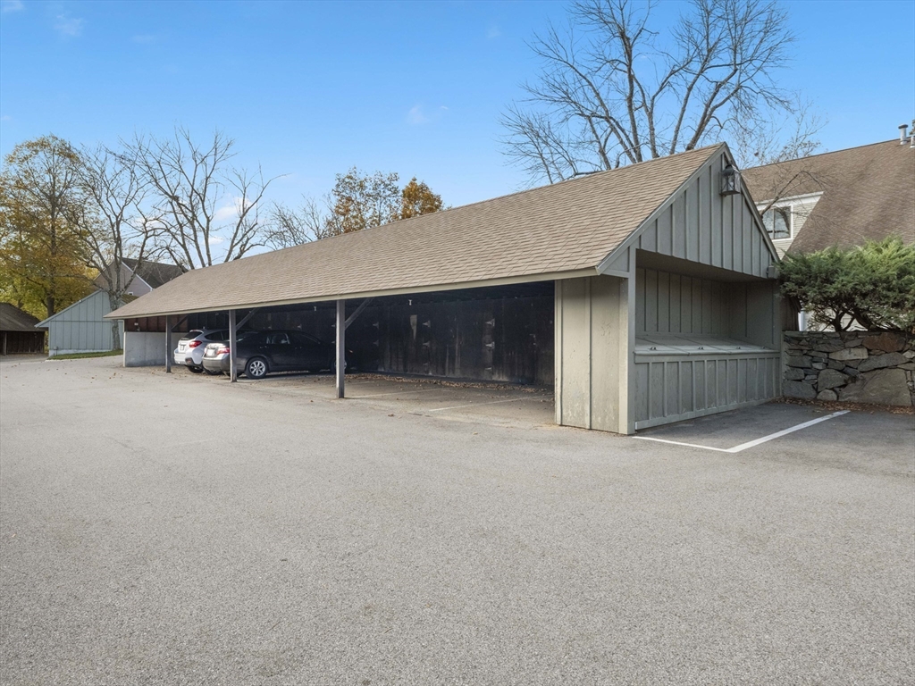 18 Concord Greene, Unit 6 Concord, MA 01742 - Photo 28 of 31 a view of a house with a yard and garage