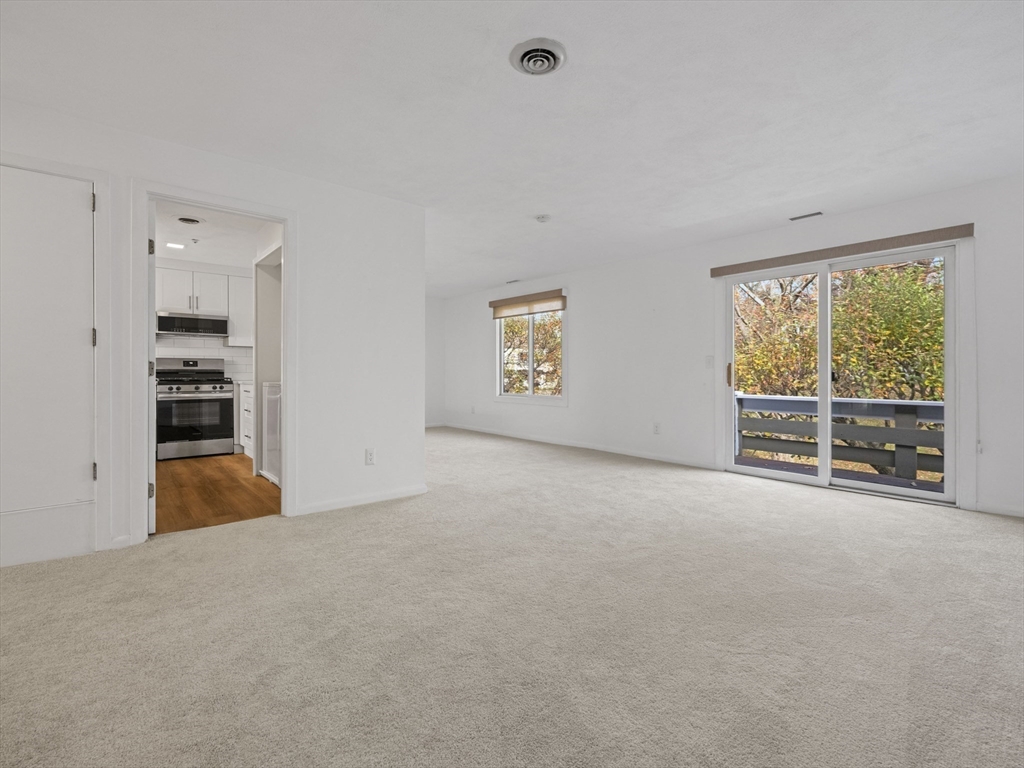 18 Concord Greene, Unit 6 Concord, MA 01742 - Photo 3 of 31 a view of an empty room with a window