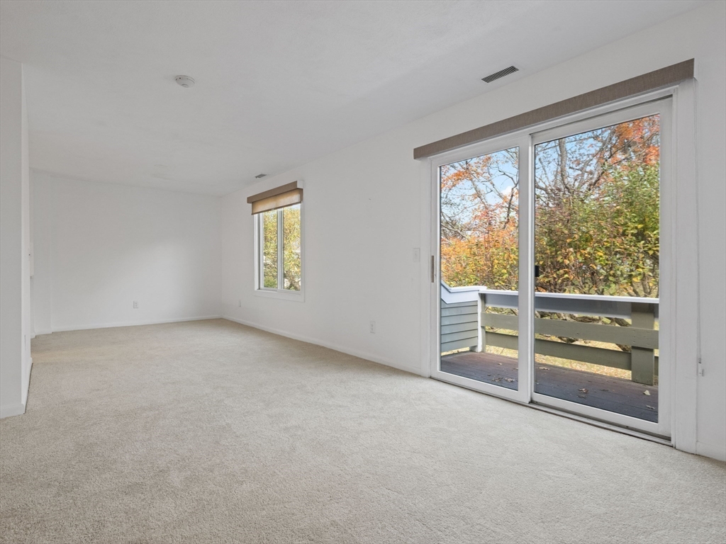 18 Concord Greene, Unit 6 Concord, MA 01742 - Photo 6 of 31 an empty room with windows