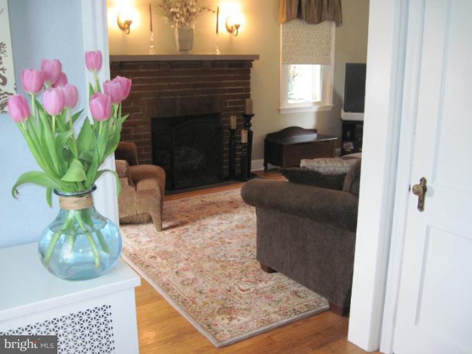 501 South Hammonds Ferry Road Linthicum Heights, MD 21090 - Photo 11 of 30 a living room with furniture and a fireplace
