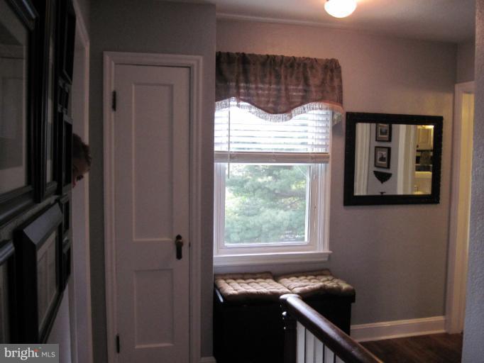 501 South Hammonds Ferry Road Linthicum Heights, MD 21090 - Photo 15 of 30 a view of a front door and wooden floor